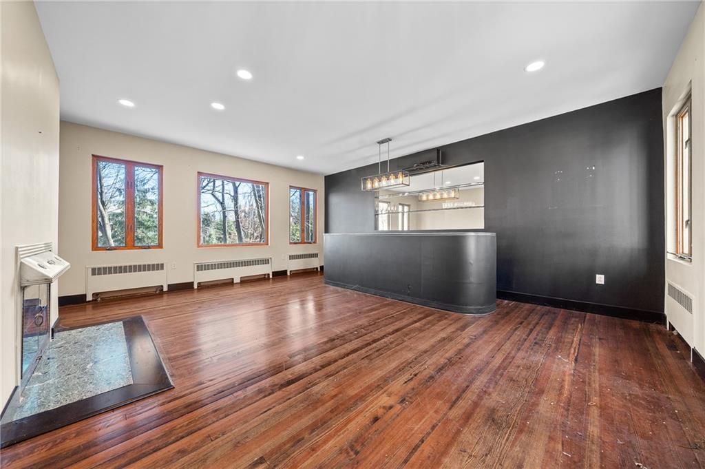115 Woodland Road Pittsburgh, PA 15232 - Photo 21 of 50 an empty room with wooden floor and windows