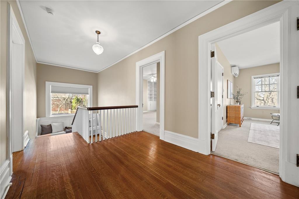 115 Woodland Road Pittsburgh, PA 15232 - Photo 24 of 50 an empty room with wooden floor and windows