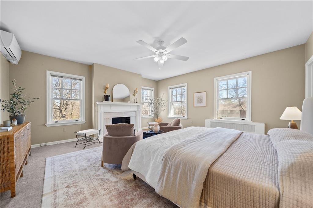 115 Woodland Road Pittsburgh, PA 15232 - Photo 26 of 50 a bedroom with a bed fireplace and window