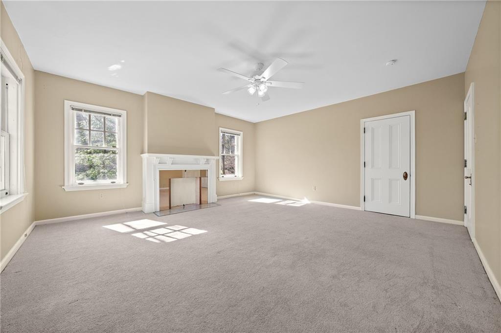 115 Woodland Road Pittsburgh, PA 15232 - Photo 30 of 50 an empty room with windows and fireplace