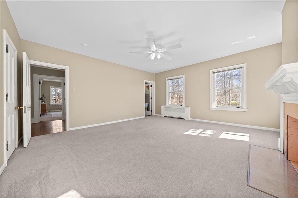 115 Woodland Road Pittsburgh, PA 15232 - Photo 31 of 50 a view of a big room with windows and chandelier fan