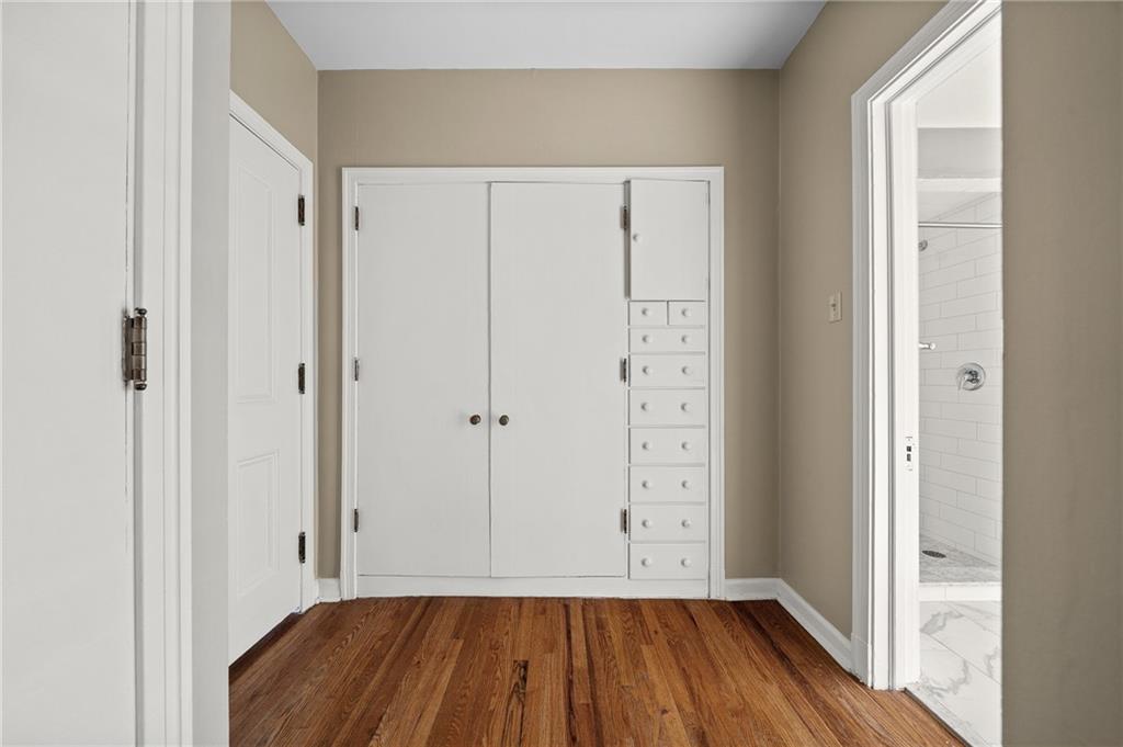115 Woodland Road Pittsburgh, PA 15232 - Photo 34 of 50 a view of room with walk in closet and wooden floor