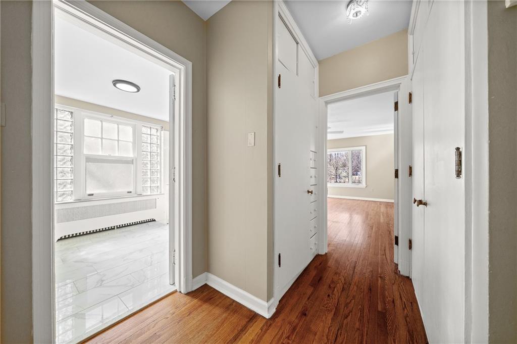 115 Woodland Road Pittsburgh, PA 15232 - Photo 35 of 50 a view of a hallway with wooden floor and a bathroom