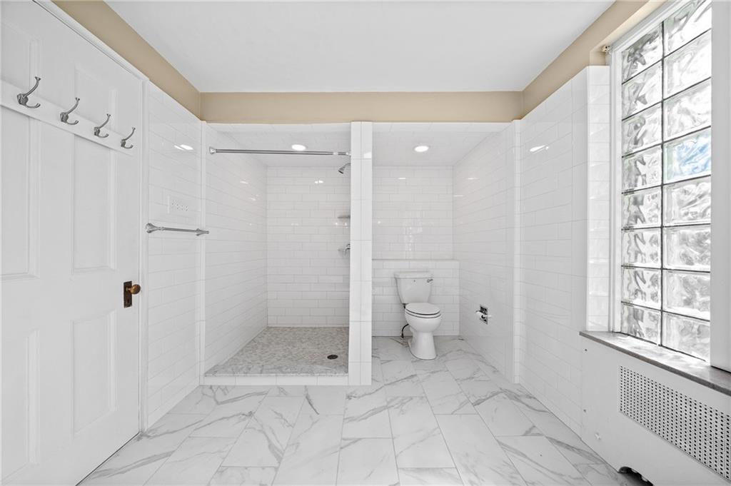 115 Woodland Road Pittsburgh, PA 15232 - Photo 37 of 50 a bathroom with a granite countertop toilet a sink and shower