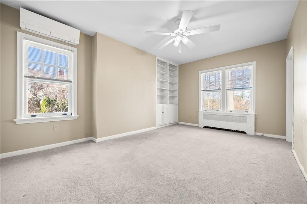 115 Woodland Road Pittsburgh, PA 15232 - Photo 38 of 50 an empty room with windows and fan