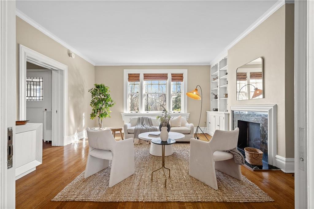 115 Woodland Road Pittsburgh, PA 15232 - Photo 4 of 50 a living room with furniture and a fireplace