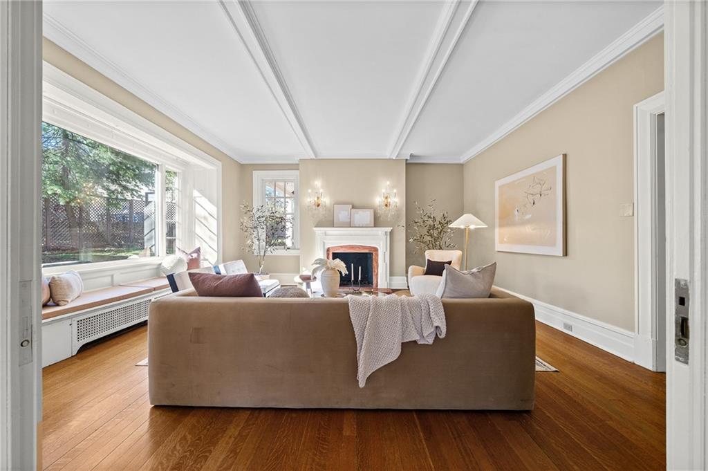 115 Woodland Road Pittsburgh, PA 15232 - Photo 8 of 50 a living room with fireplace furniture and a large window