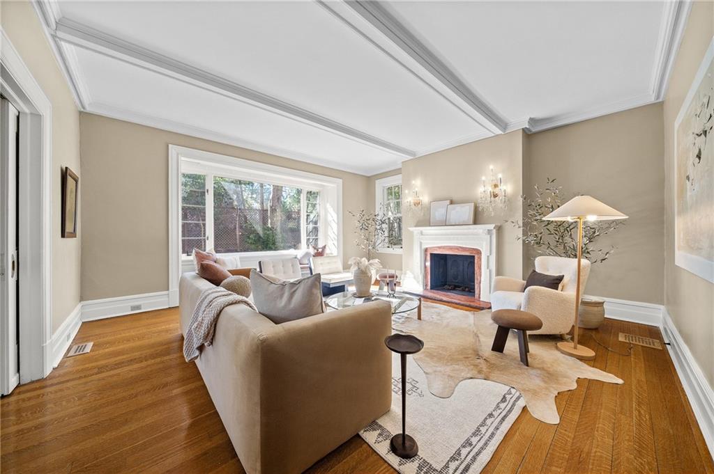 115 Woodland Road Pittsburgh, PA 15232 - Photo 9 of 50 a living room with furniture large window and a fireplace