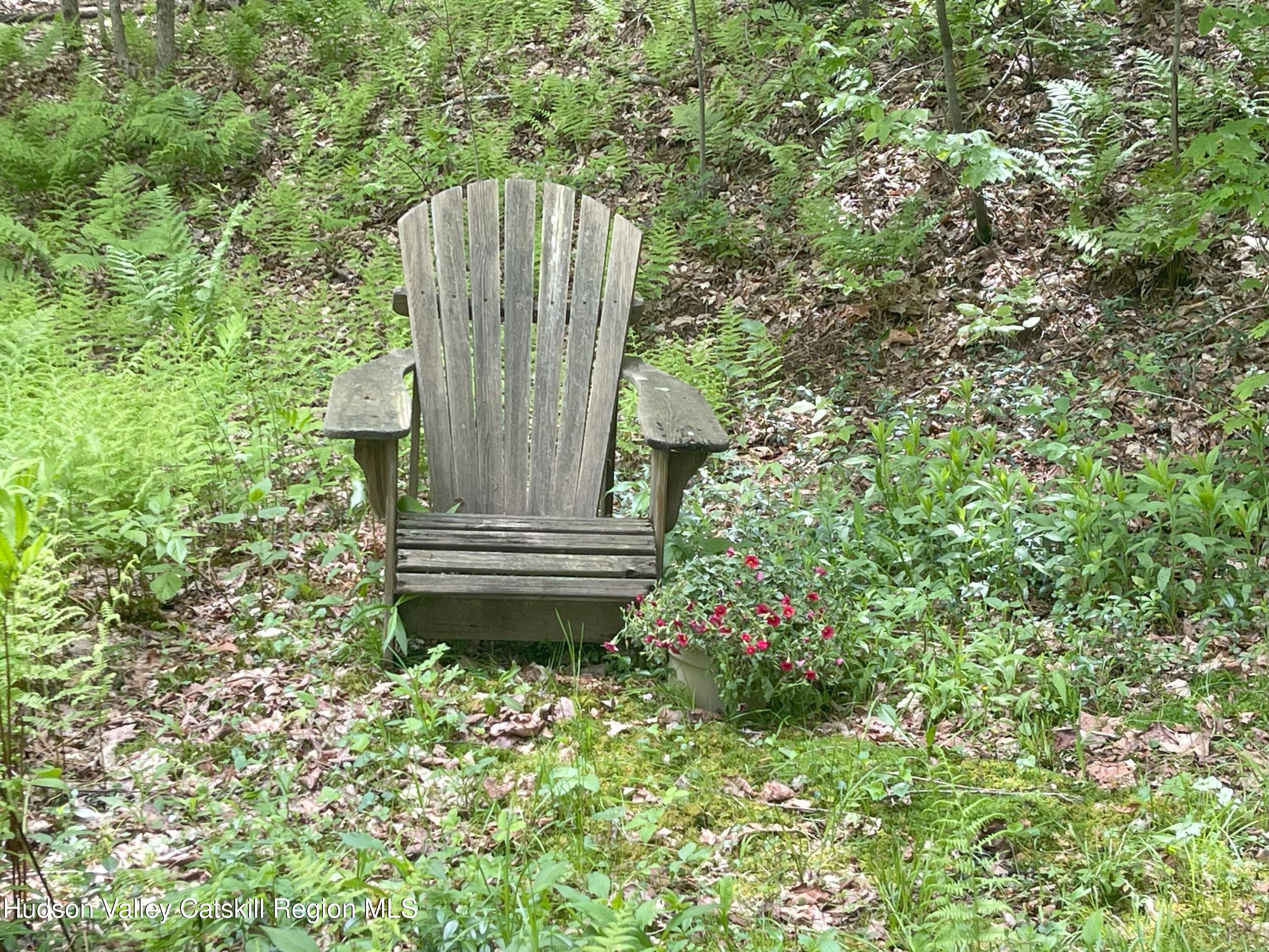 1011 West Settlement Road Roxbury, NY 12474 - Photo 30 of 32 IMG_0669.ad chair with flowers