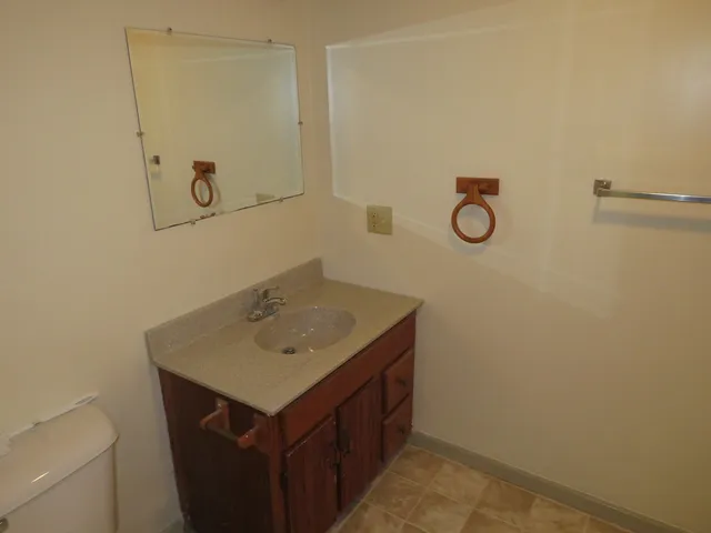 a bathroom with a sink and mirror