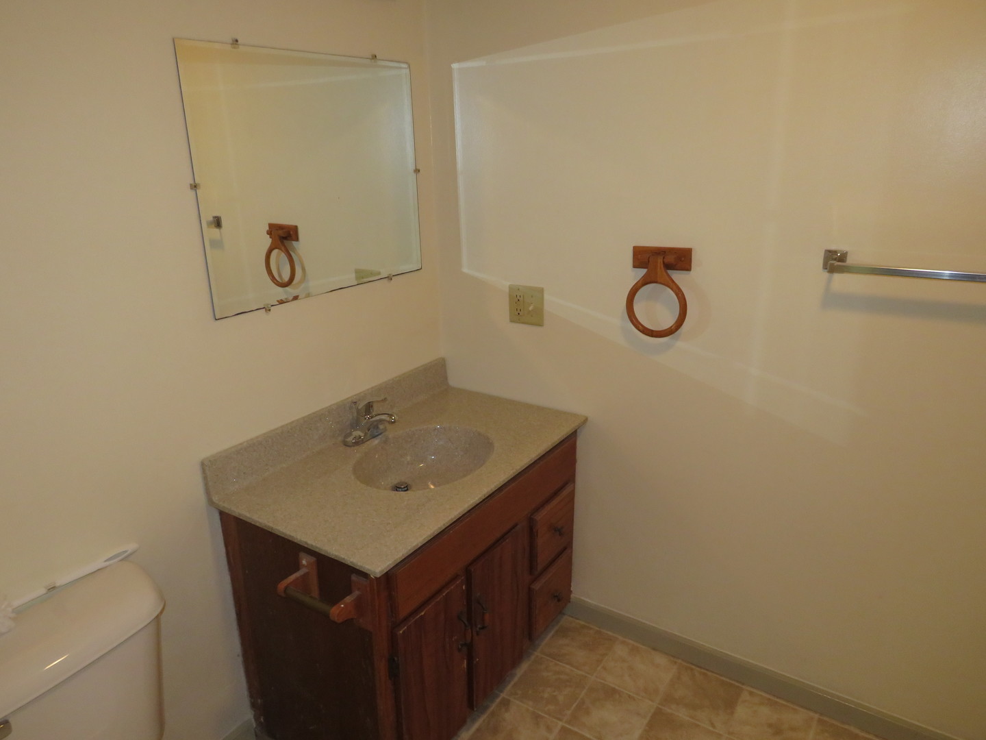 306 East Main Street, Unit B Ottawa, IL 61350 - Photo 11 of 15 a bathroom with a sink and mirror