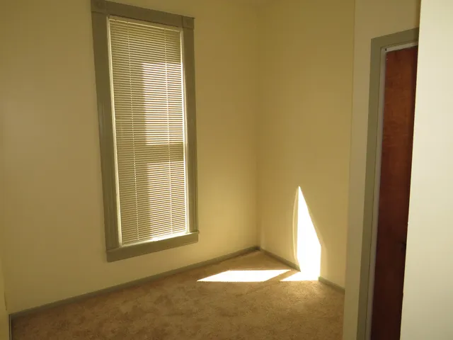 a view of a room that has a window in it