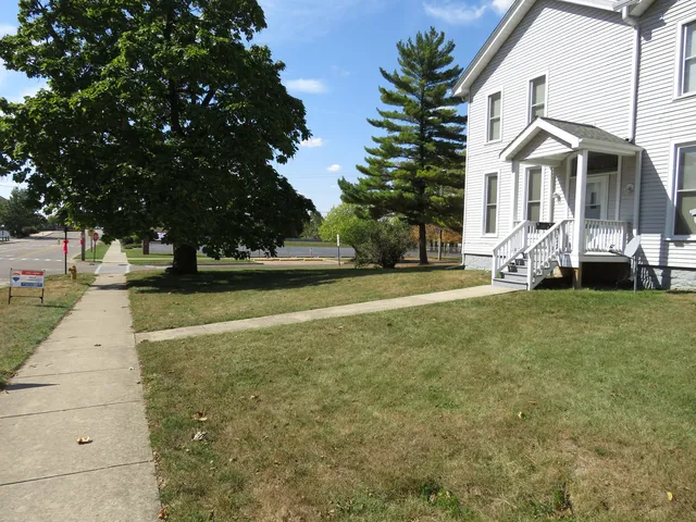 a view of house with yard
