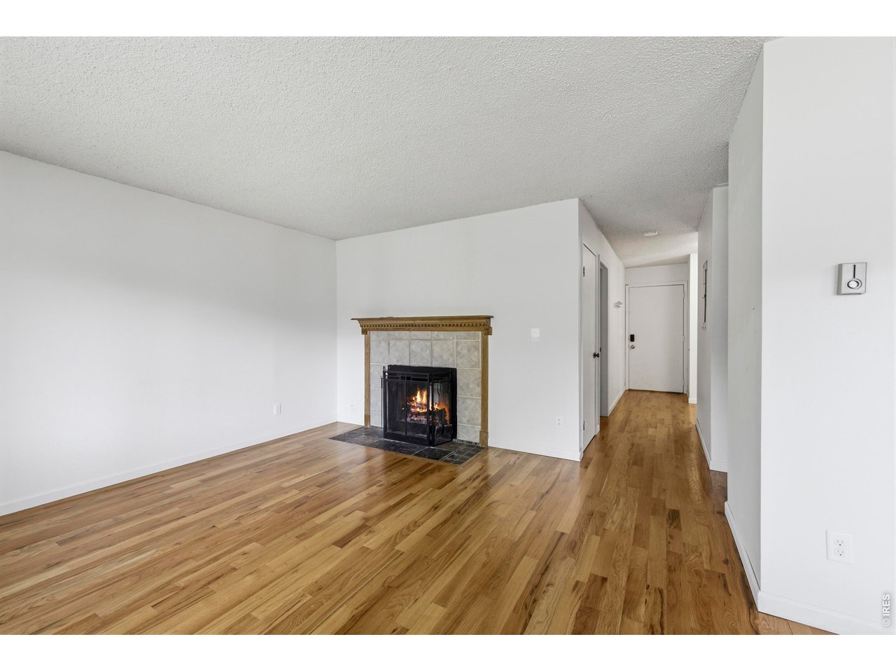925 Columbia Road, Unit 824 Fort Collins, CO 80525 - Photo 4 of 36 a view of an empty room and a fireplace