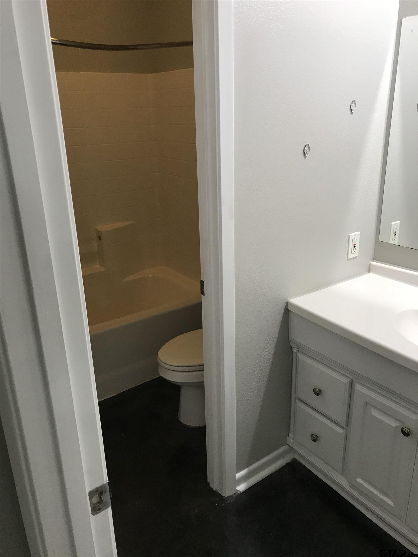 19040 FM 2493 Flint, TX 75762 - Photo 14 of 18 a bathroom with a granite countertop sink toilet and shower