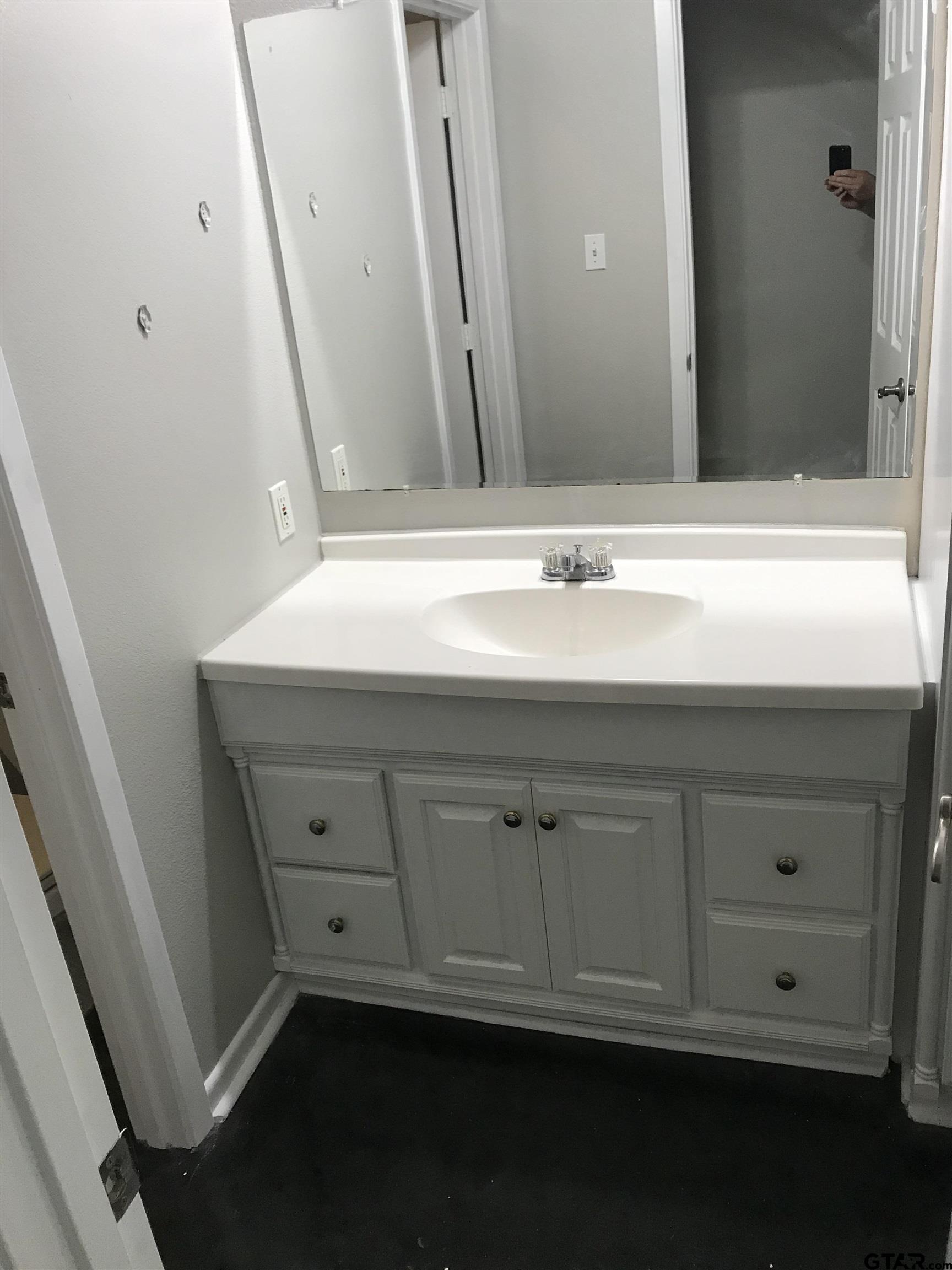 19040 FM 2493 Flint, TX 75762 - Photo 15 of 18 a bathroom with a sink and a mirror