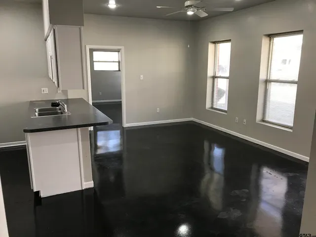 a view of a livingroom with furniture and window