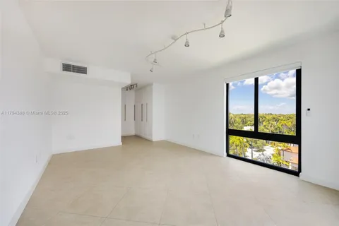 a view of an empty room with a large window