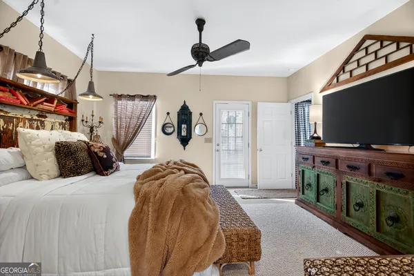 a kitchen with a sink dishwasher and a stove with wooden floor