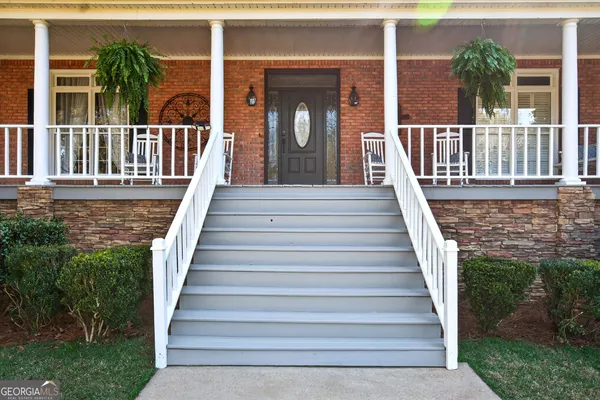 a view of a balcony with wooden floor