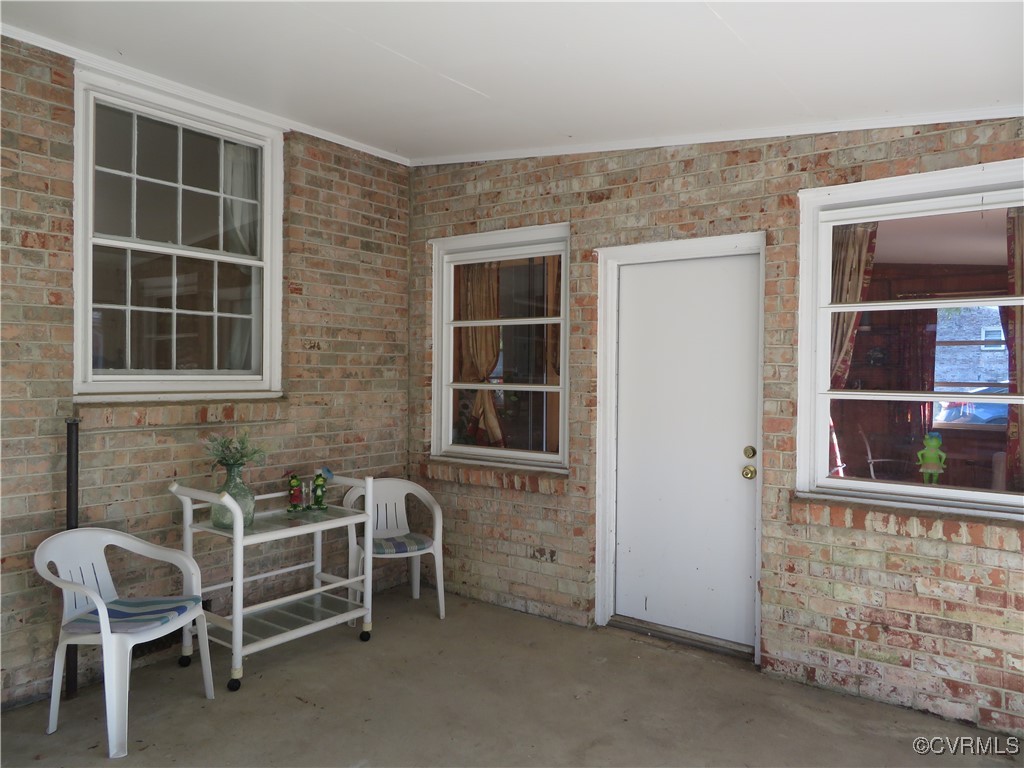 4612 Fairway Road Petersburg, VA 23803 - Photo 16 of 50 a backyard of a house with table and chairs