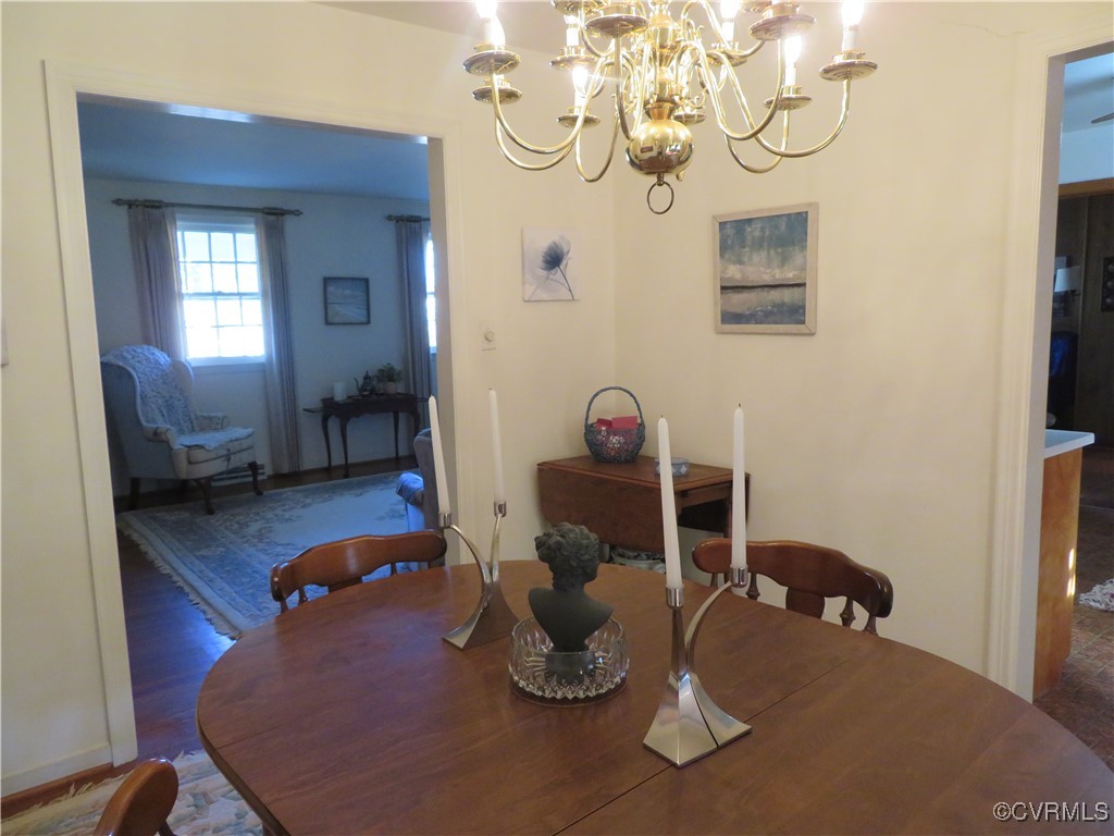 4612 Fairway Road Petersburg, VA 23803 - Photo 26 of 50 a dining room with wooden floor and a chandelier