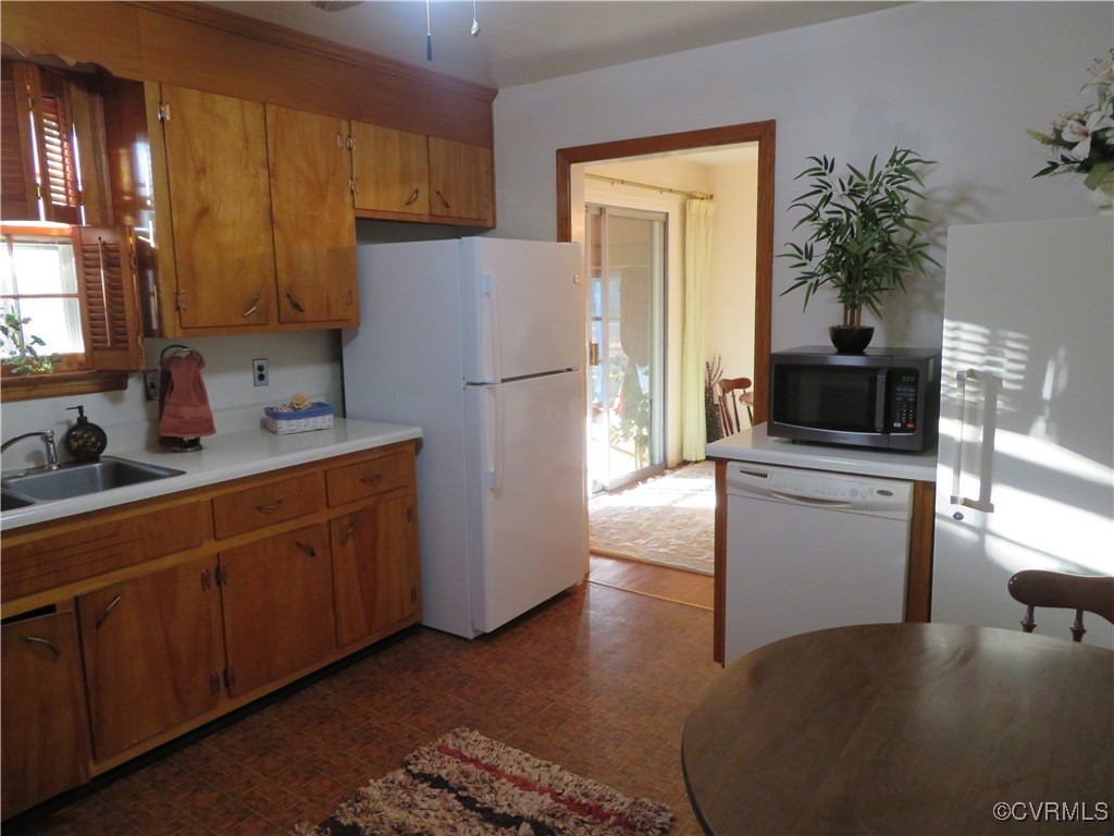 4612 Fairway Road Petersburg, VA 23803 - Photo 28 of 50 a kitchen with sink a microwave and refrigerator