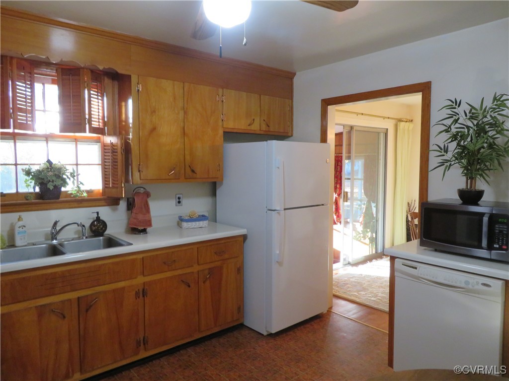 4612 Fairway Road Petersburg, VA 23803 - Photo 32 of 50 a kitchen with refrigerator and cabinets