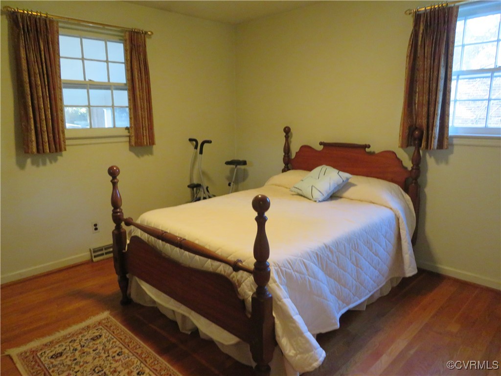 4612 Fairway Road Petersburg, VA 23803 - Photo 37 of 50 a bedroom with a bed and wooden floor