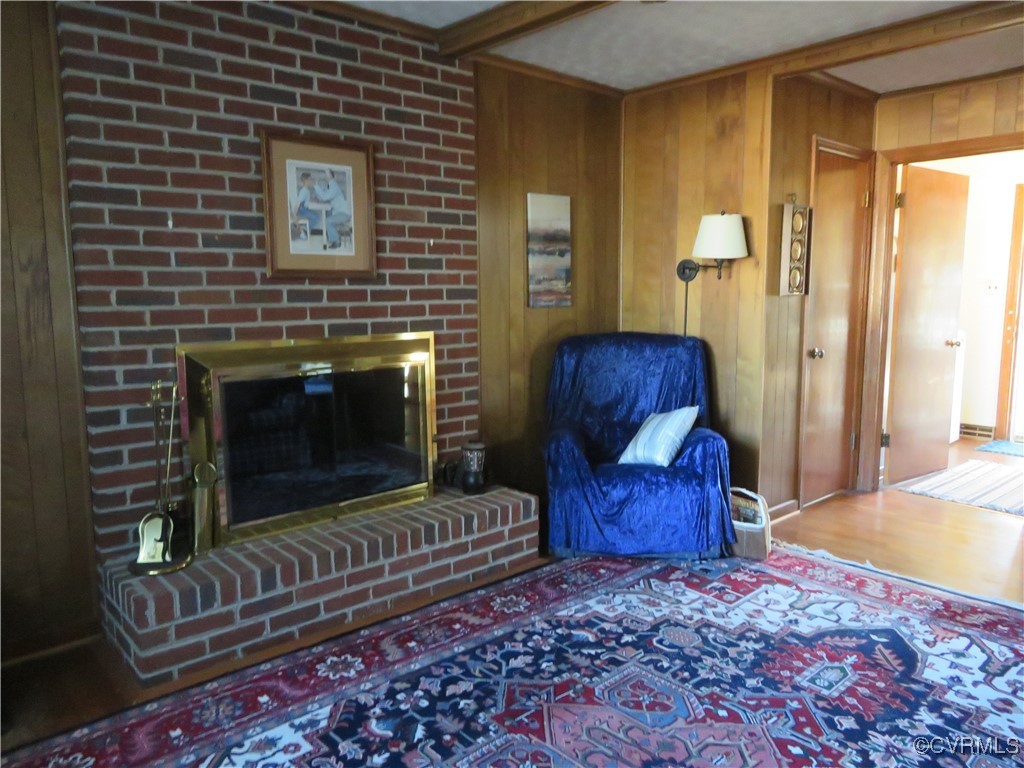 4612 Fairway Road Petersburg, VA 23803 - Photo 47 of 50 a living room with furniture a rug and a fireplace