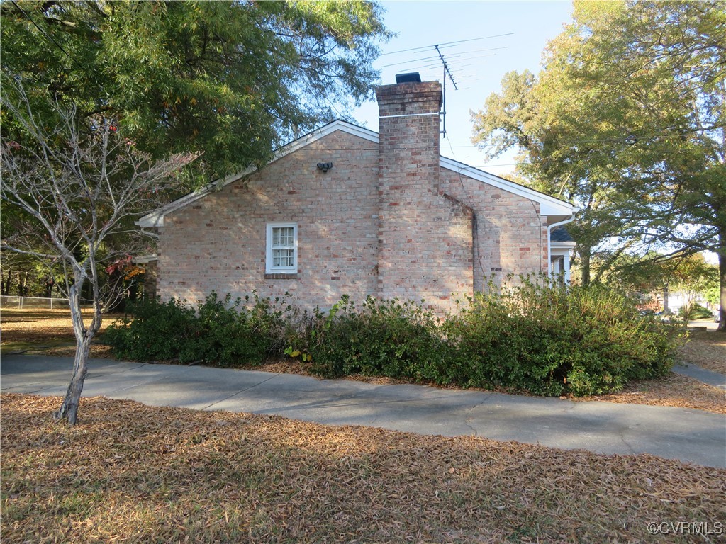 4612 Fairway Road Petersburg, VA 23803 - Photo 8 of 50 a front view of a house with a yard and tree s