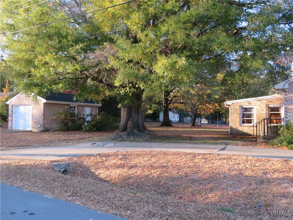 4612 Fairway Road Petersburg, VA 23803 - Photo 9 of 50 a view of a yard with plants and trees
