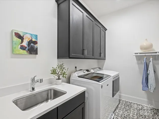 a kitchen that has a sink and a stove