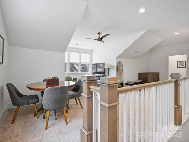 a view of a kitchen and a dining room with furniture