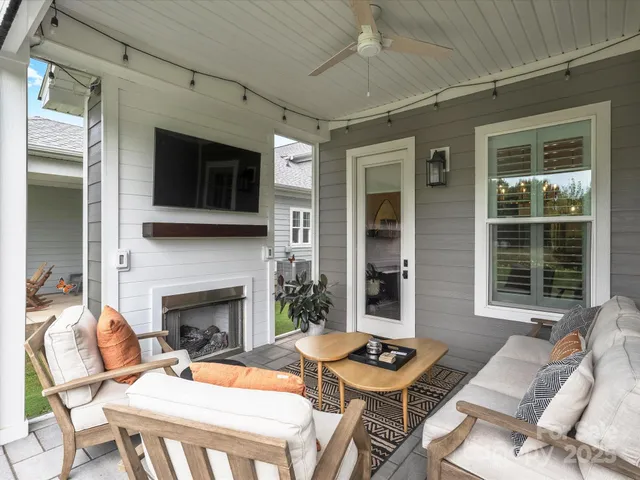a outdoor space with patio furniture and a fireplace