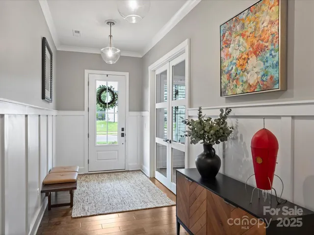 a view of living room filled with furniture and window