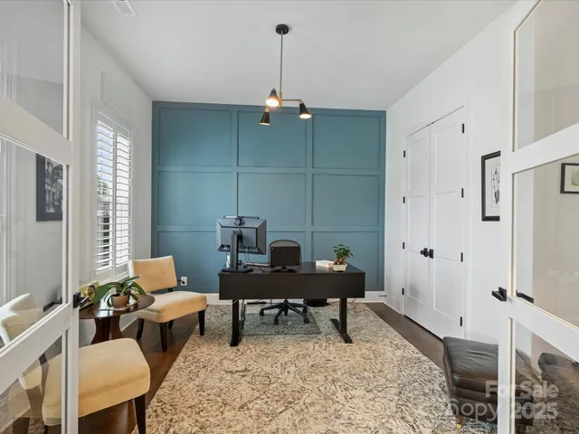 a living room with furniture a window and a table