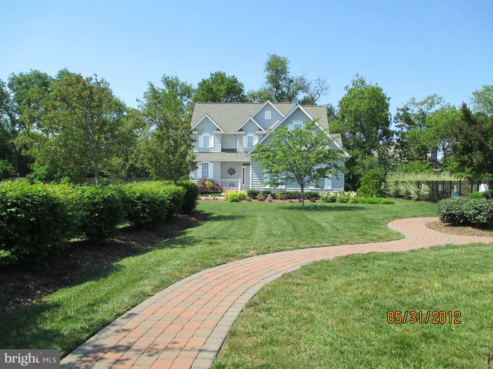86 Swaggers Point Road Solomons, MD 20688 - Photo 11 of 13 Brick paths throughout community