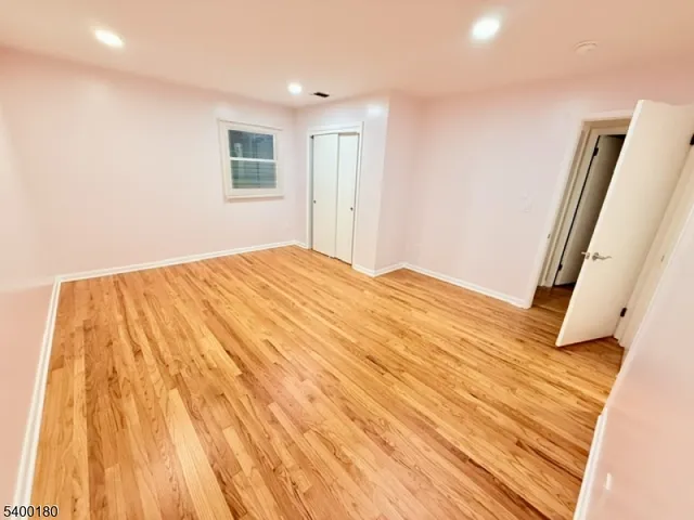 a bedroom with a bed and a mirror