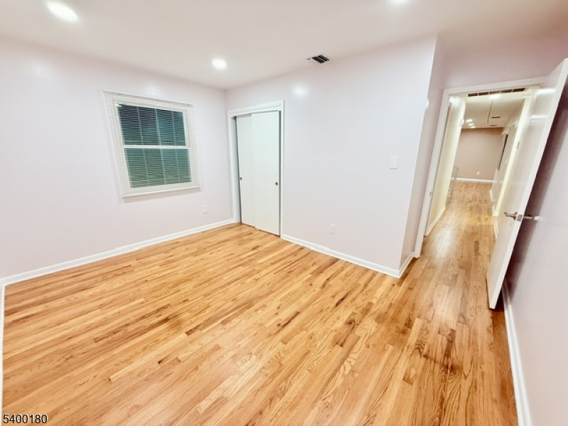 6 Hillside Avenue Netcong, NJ 07857 - Photo 13 of 28 a view of empty room with wooden floor and fan