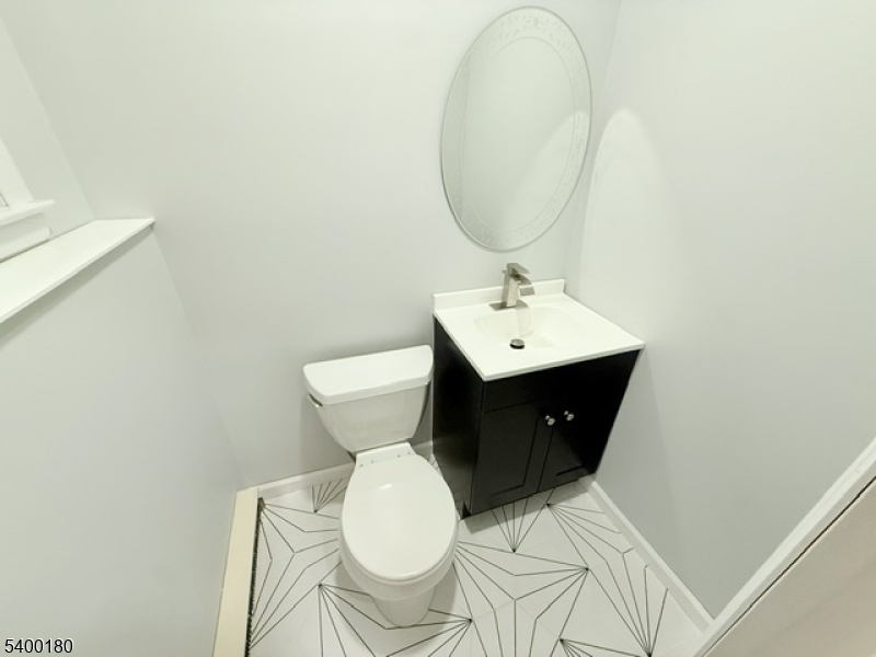 6 Hillside Avenue Netcong, NJ 07857 - Photo 19 of 28 a bathroom with a toilet a sink and mirror