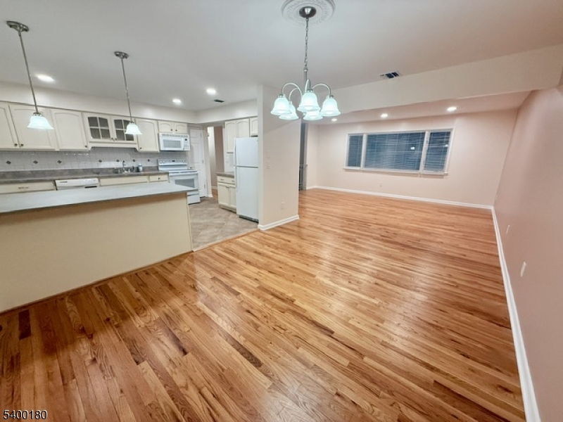 6 Hillside Avenue Netcong, NJ 07857 - Photo 20 of 26 a view of a kitchen with a sink dishwasher a refrigerator and wooden floor
