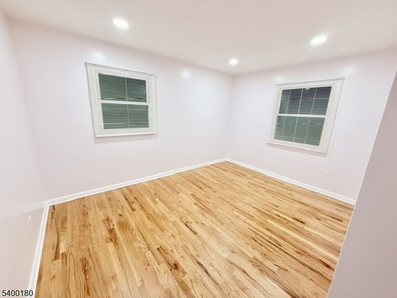 6 Hillside Avenue Netcong, NJ 07857 - Photo 8 of 26 a view of an empty room with wooden floor and a window