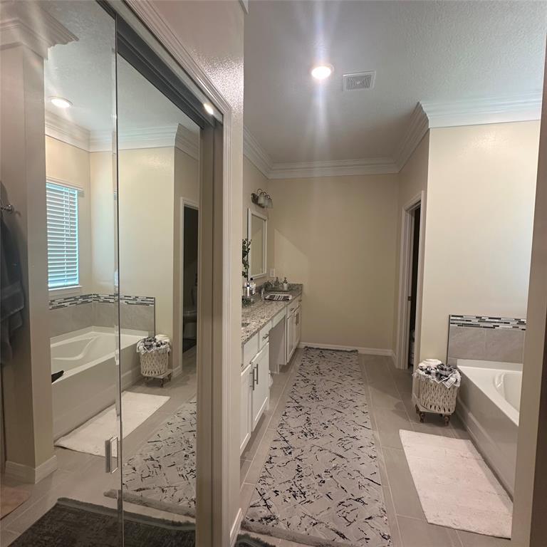 12304 Southwest Forli Way Port St. Lucie, FL 34987 - Photo 15 of 26 a bathroom with a tub shower and sink