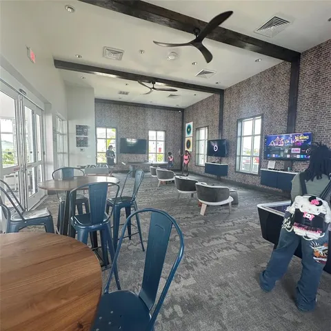 a view of a swimming pool with an outdoor seating