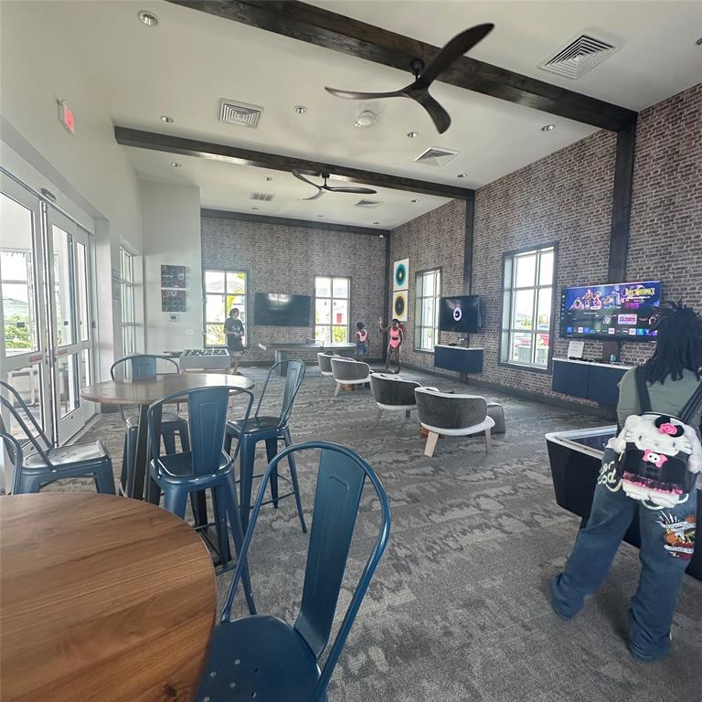 12304 Southwest Forli Way Port St. Lucie, FL 34987 - Photo 23 of 26 a view of a dining room with furniture