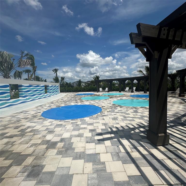 12304 Southwest Forli Way Port St. Lucie, FL 34987 - Photo 24 of 26 a view of a swimming pool with an outdoor seating
