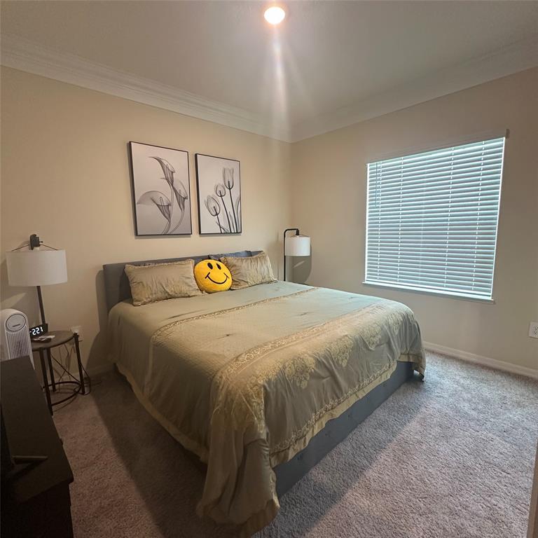 12304 Southwest Forli Way Port St. Lucie, FL 34987 - Photo 5 of 26 a bedroom with a bed and window