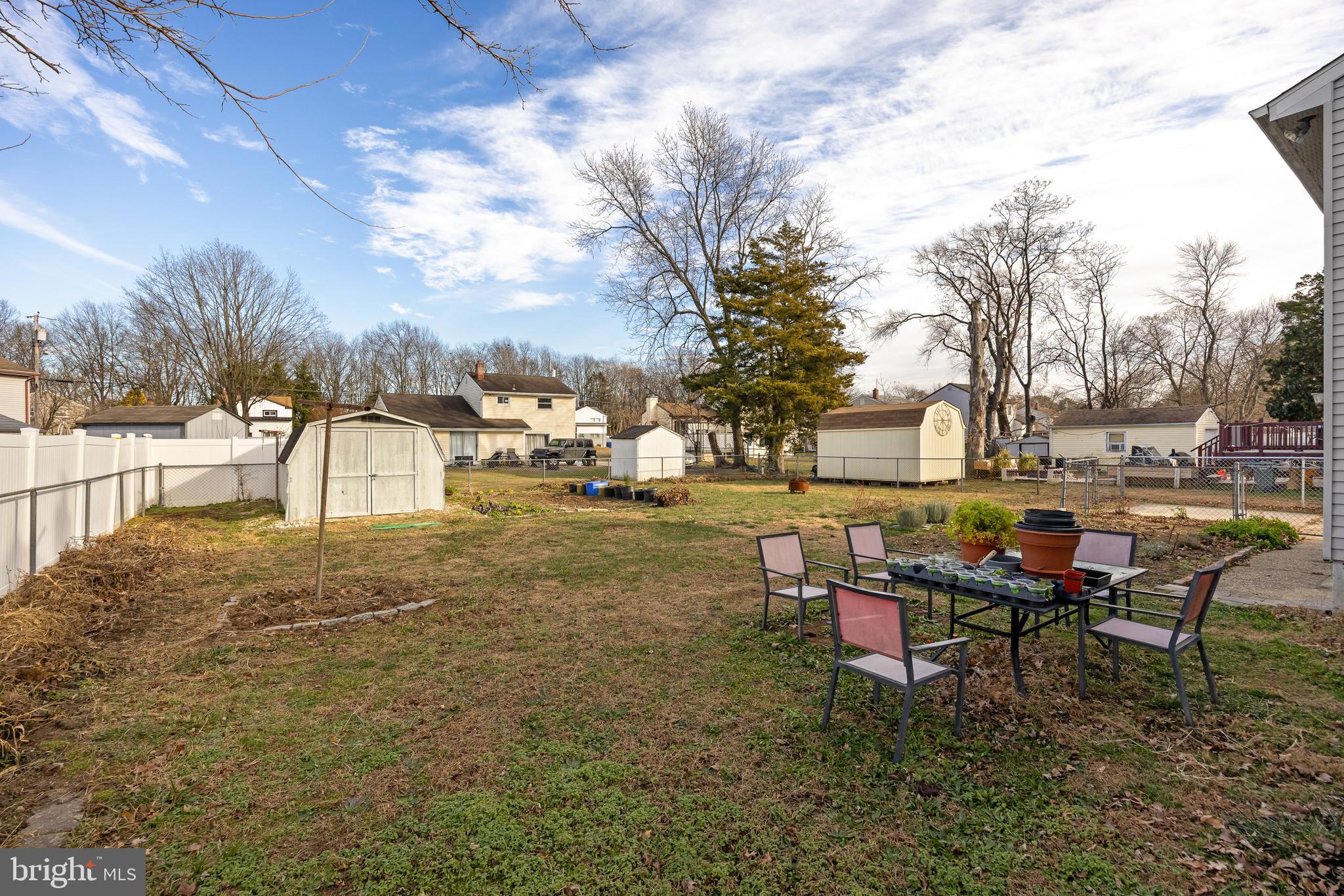 118 Somerset Road Glassboro, NJ 08028 - Photo 6 of 7 a backyard of a house with table and chairs