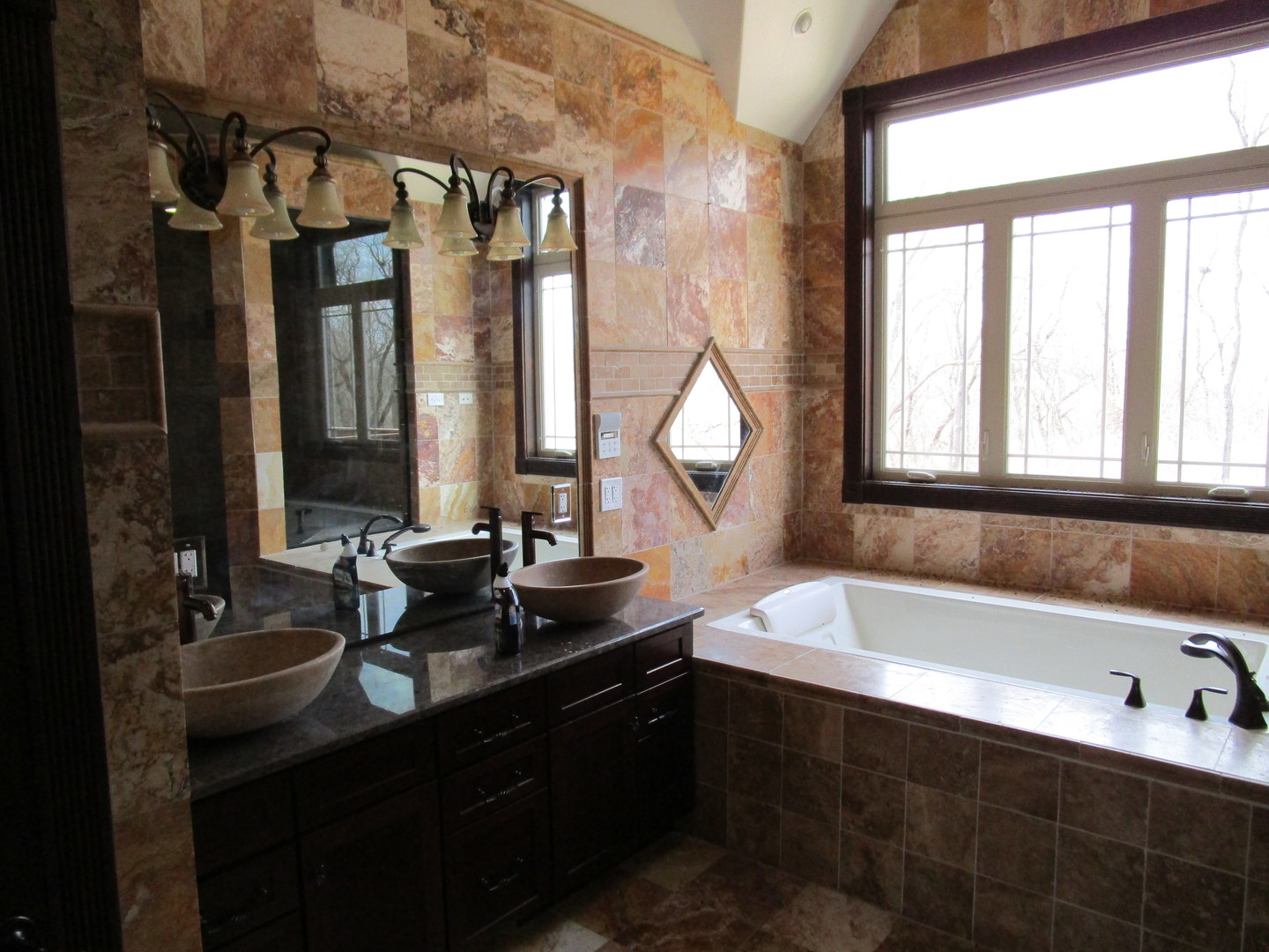 6909 Schultz Road Harvard, IL 60033 - Photo 15 of 19 a bathroom with a bathtub sink and mirror